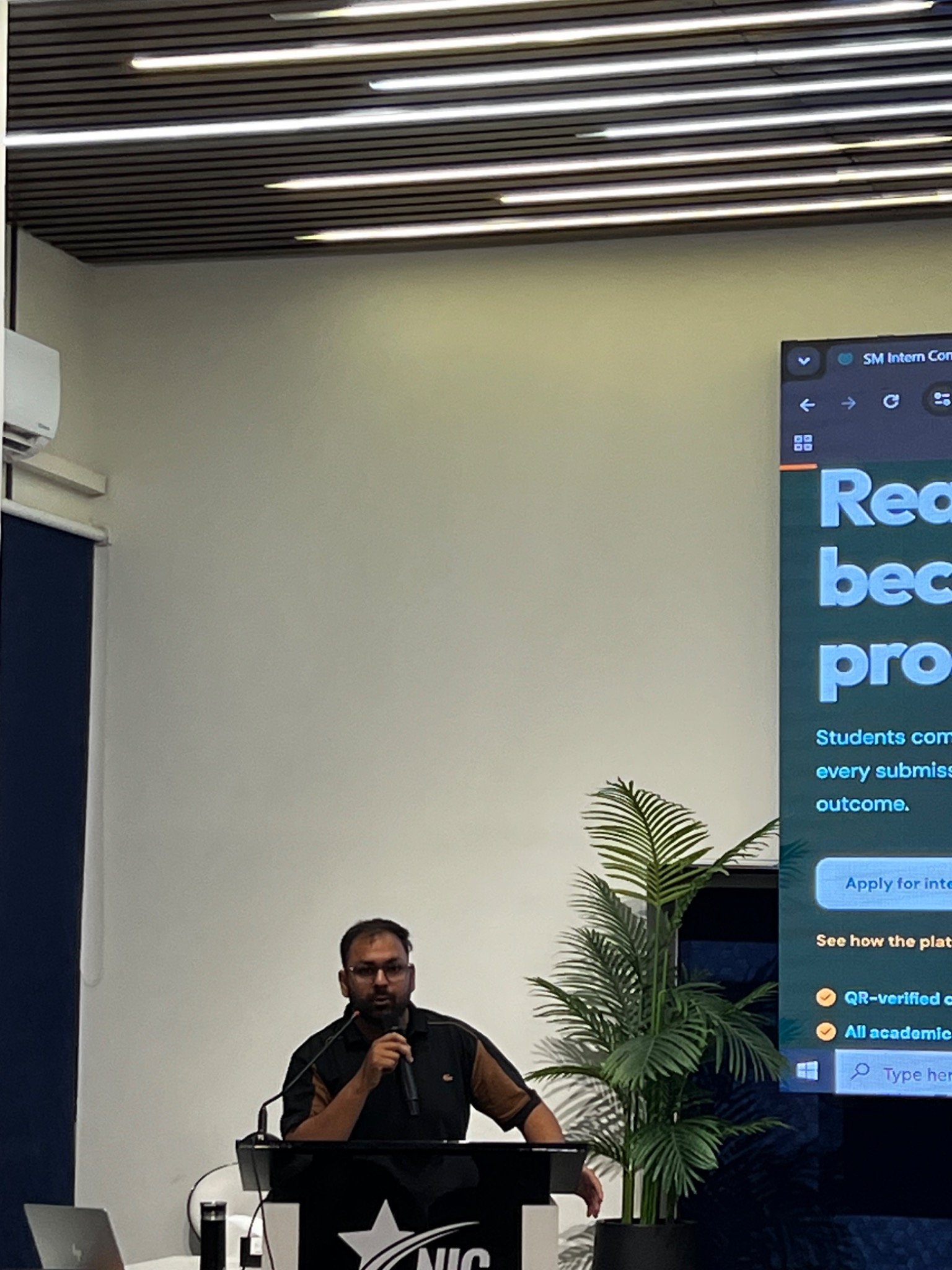 A speaker at the lectern during the SM Intern Connect presentation